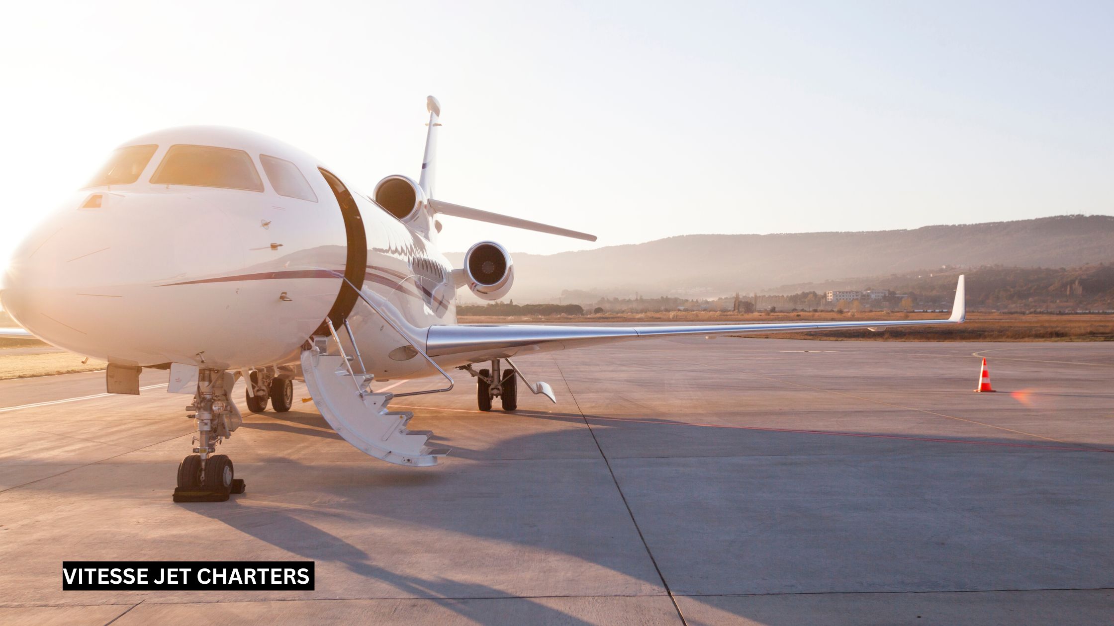 Sleek private jet parked on runway with stairs extended for elegant boarding.